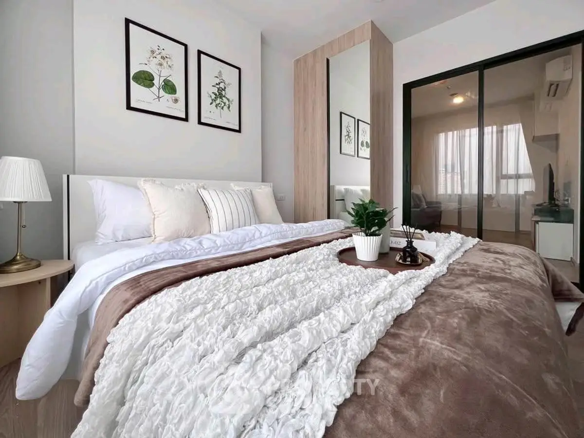 Elegant bedroom with cozy bedding and stylish decor in modern apartment