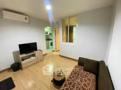 Cozy living room with modern furnishings and open kitchen view