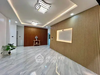 Elegant modern interior with stylish lighting and wood paneling, perfect for sophisticated living spaces.