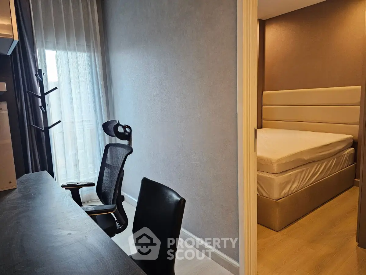 Modern apartment with study area and cozy bedroom, perfect for urban living.