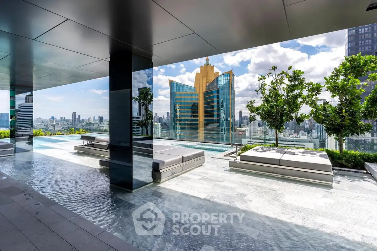Luxurious rooftop pool with stunning city skyline views and modern lounge seating.