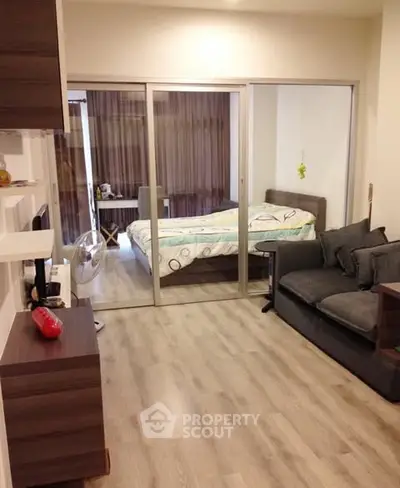 Modern studio apartment with open layout and cozy bedroom