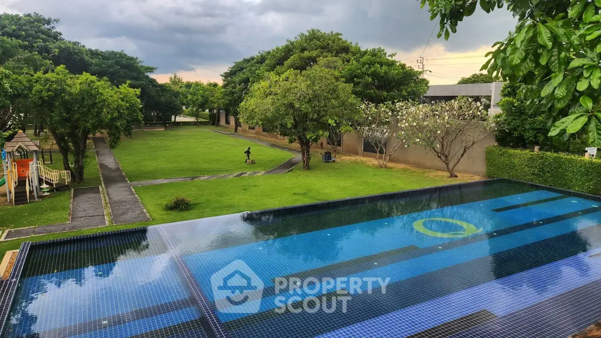 Luxurious property with stunning pool and lush garden view