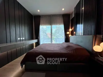 Luxurious modern bedroom with elegant lighting and large window view