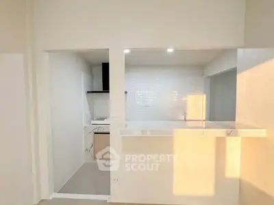 Modern kitchen with open layout and sleek marble countertop