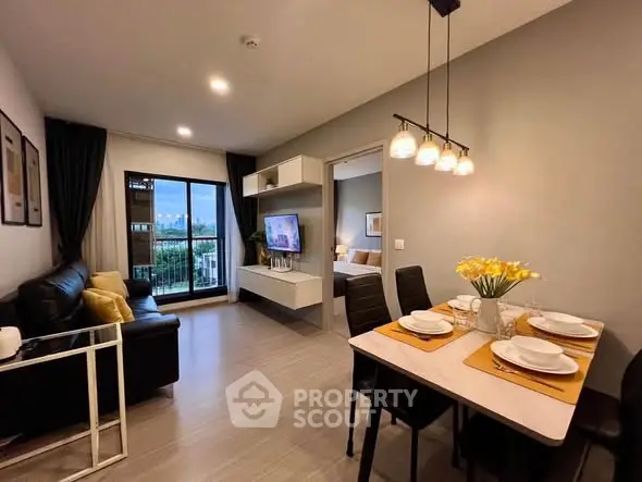 Modern living room with dining area and balcony view in stylish apartment