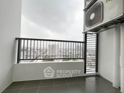 Modern balcony with city view and air conditioning unit, perfect for urban living.