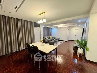 Spacious living room with elegant dining area and modern decor