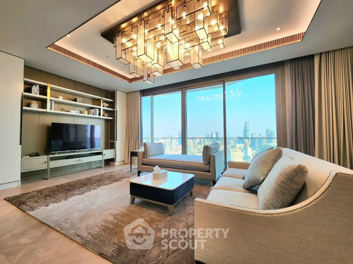 Luxurious living room with stunning city view, elegant chandelier, and modern furnishings in high-rise apartment.