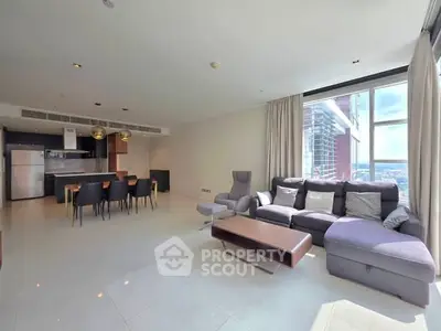 Spacious modern living room with city view and open kitchen layout