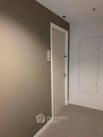 Modern apartment entrance with sleek design and neutral colors.