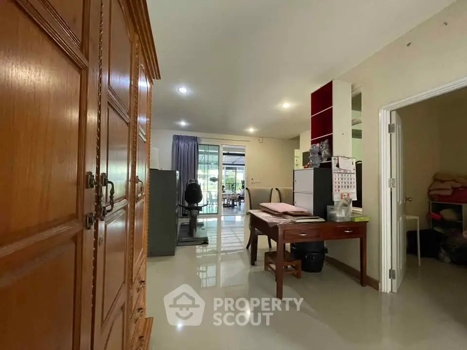 Spacious living area with elegant wooden furniture and open layout