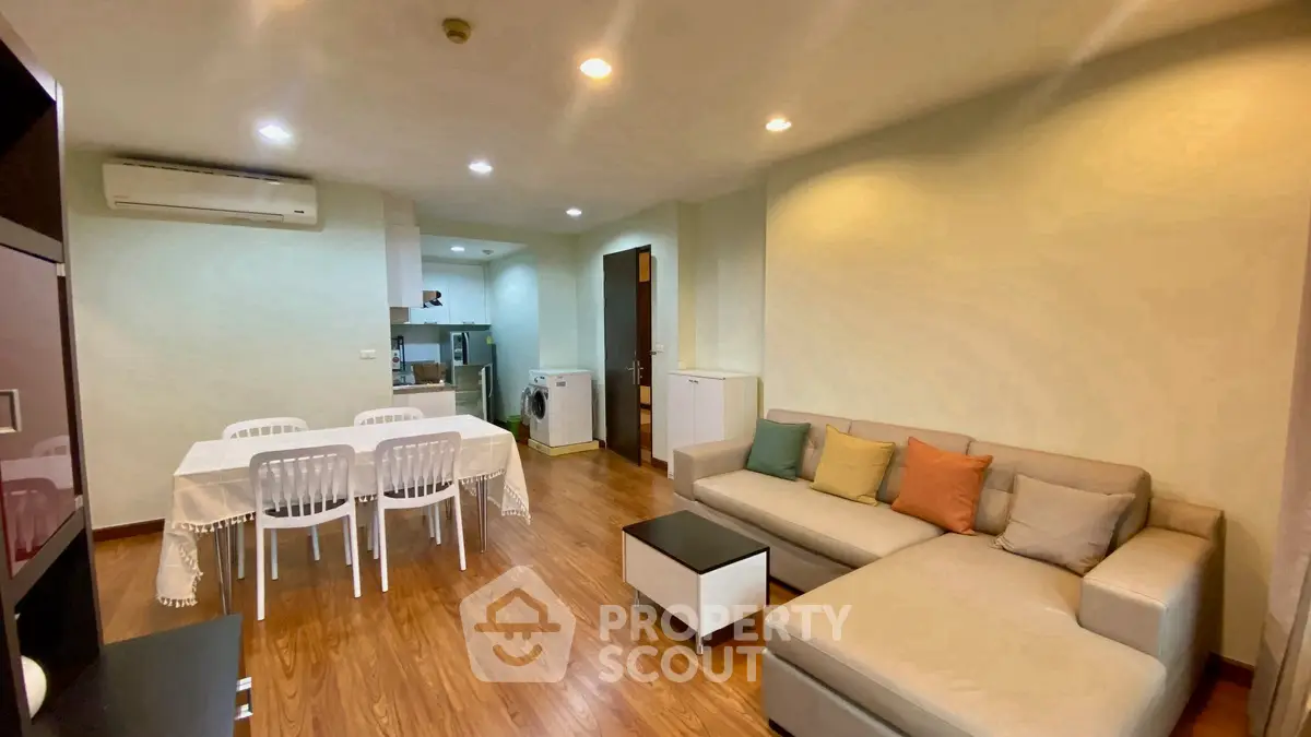 Spacious living room with modern furniture and dining area