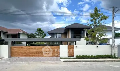 Modern two-story house with sleek design and spacious driveway in a serene neighborhood.
