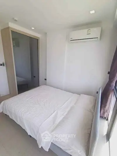 Bright and cozy bedroom with modern air conditioning and natural light