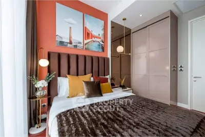 Luxurious bedroom with modern decor and plush bedding in a stylish apartment.
