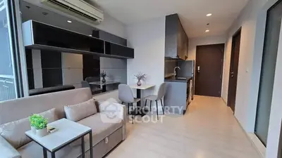 Modern living room with sleek kitchen in open layout apartment