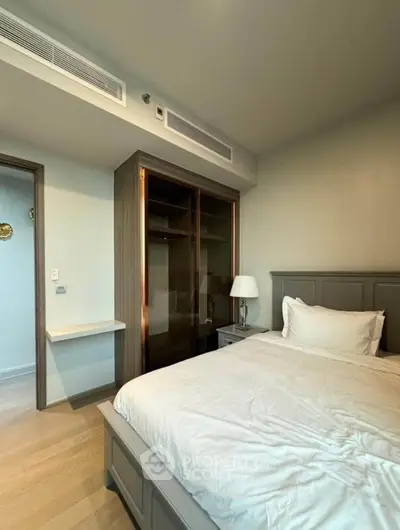 Cozy bedroom with elegant wooden wardrobe and modern decor