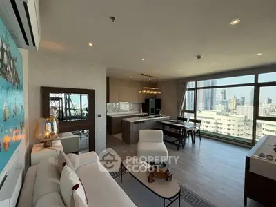 Luxurious open-plan living room with stunning city views and modern furnishings.