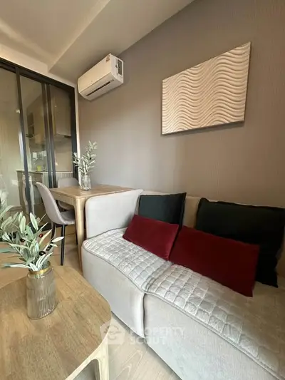 Modern living room with stylish decor and air conditioning