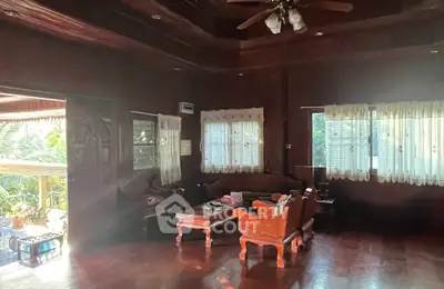 Spacious living room with wooden interior and natural light