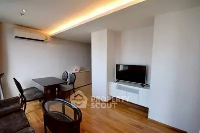 Modern living room with sleek furniture and wooden flooring