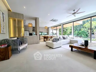 Spacious modern living room with open layout and garden view