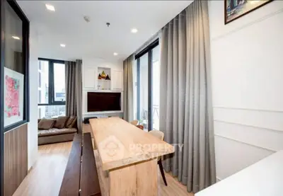 Modern living room with elegant wooden table and cozy seating area