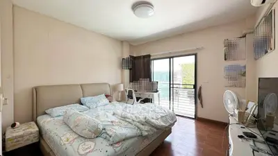 Cozy bedroom with balcony access and stylish decor in modern apartment