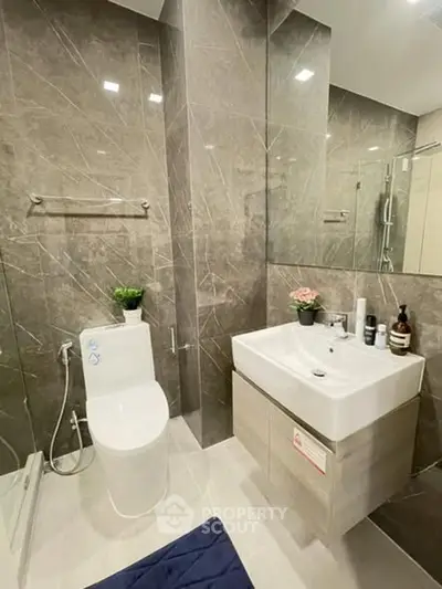 Modern bathroom with sleek fixtures and elegant marble tiles