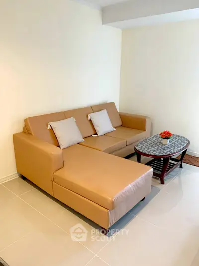 Cozy living room with beige sectional sofa and stylish coffee table