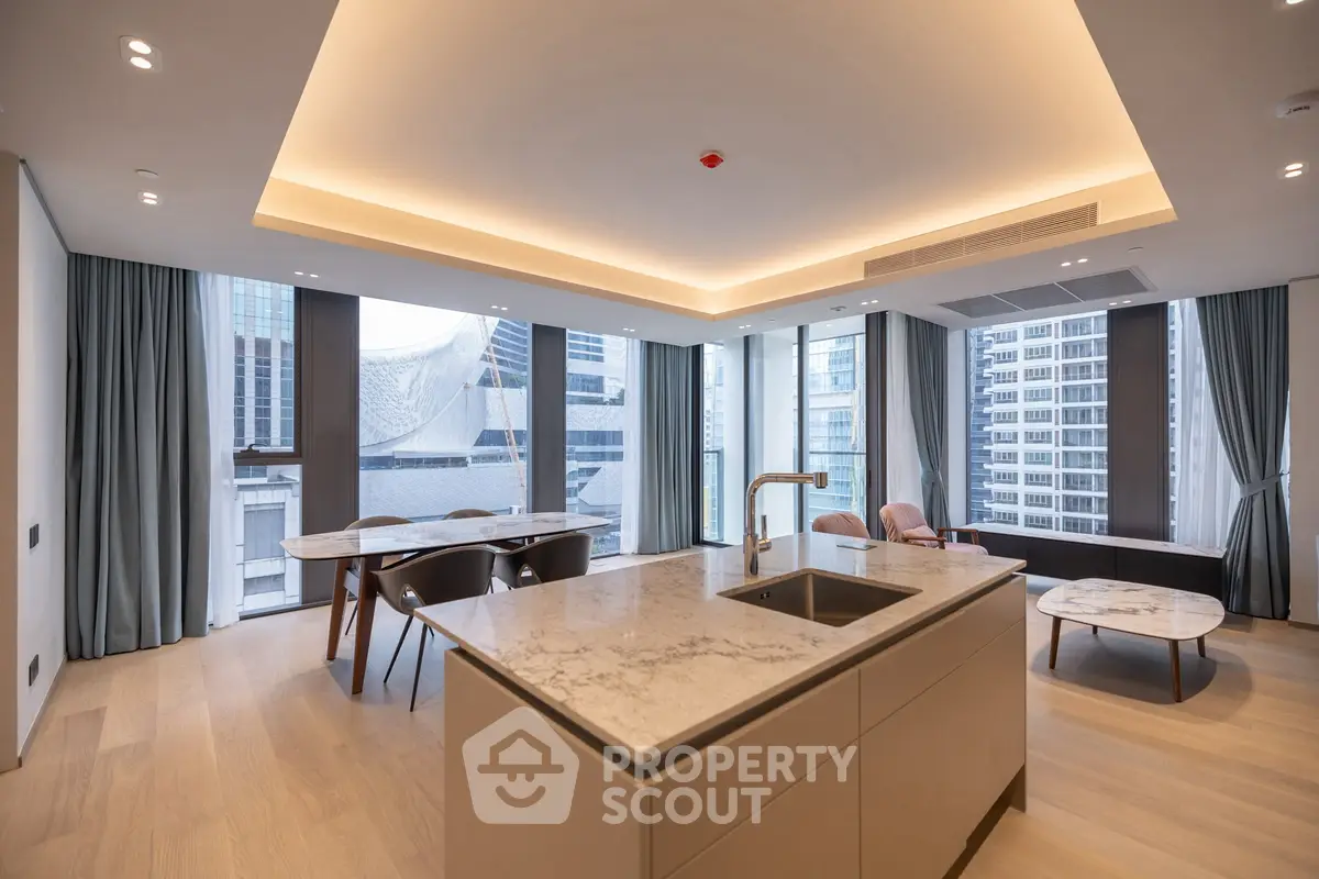 Luxurious modern living room with open kitchen and stunning city view