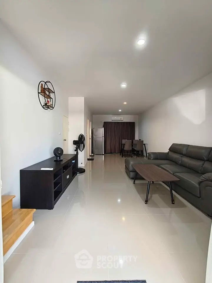 Spacious modern living room with sleek furniture and open layout