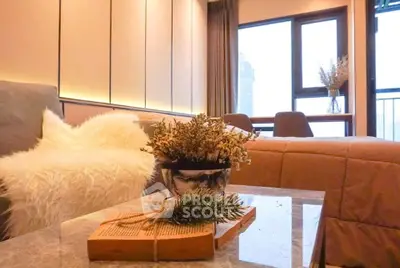 Cozy living room with modern decor and large window view