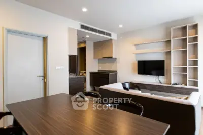 Modern living room with sleek furniture and built-in shelving, perfect for contemporary living.