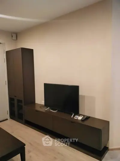 Modern living room with sleek TV stand and cabinet, perfect for stylish urban living.