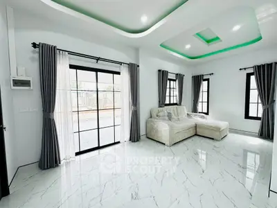 Spacious modern living room with elegant marble flooring and stylish ceiling lights.