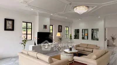 Elegant living room with modern decor, plush sofas, and a stylish chandelier, perfect for luxury living.