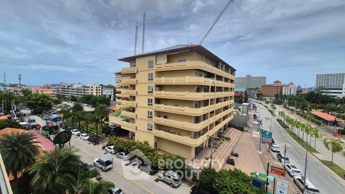 Stunning multi-story building with balconies and city view, perfect for urban living.