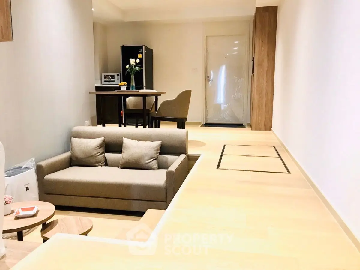 Modern open-plan living room with stylish furniture and natural light