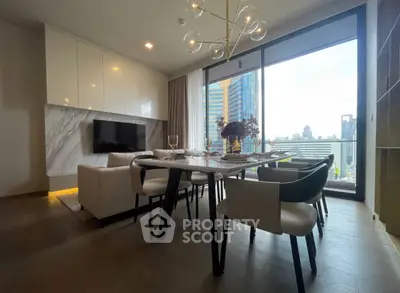 Luxurious modern living room with elegant dining area and stunning city view.