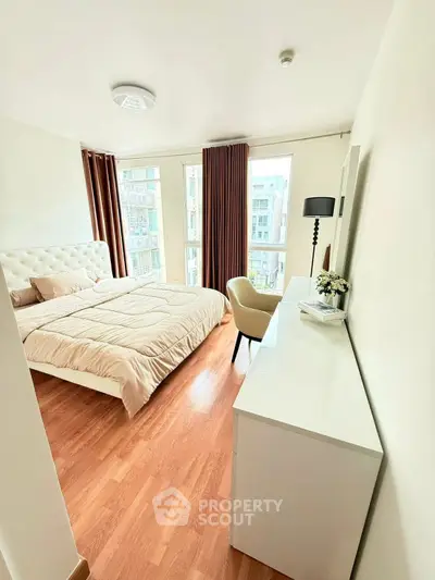 Bright and cozy bedroom with modern decor and large windows