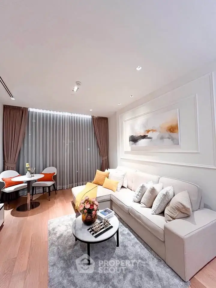 Elegant living room with modern decor, cozy seating, and stylish artwork, perfect for relaxation and entertaining.