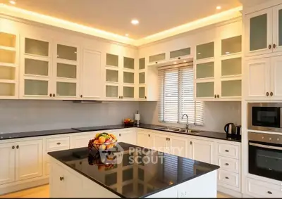 Luxurious modern kitchen with sleek cabinetry and island, perfect for culinary enthusiasts.