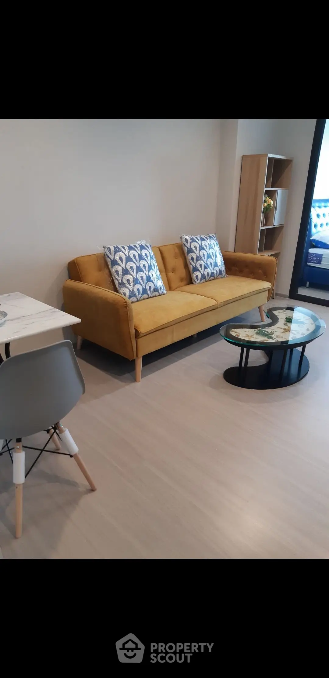 Modern living room with stylish yellow sofa and chic coffee table
