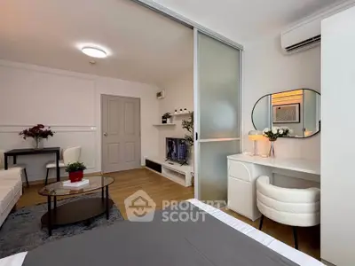 Modern studio apartment with stylish decor and open layout, featuring a cozy living area and workspace.