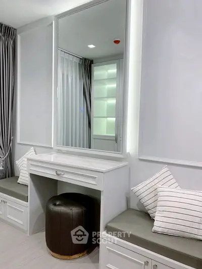 Elegant modern study area with built-in seating and large mirror