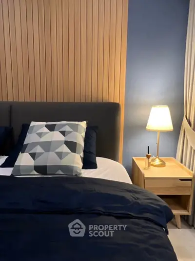 Cozy modern bedroom with stylish decor and ambient lighting
