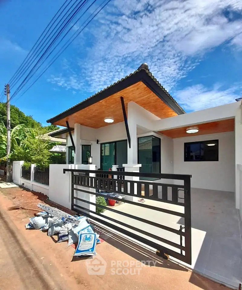 Modern single-story house with sleek design and spacious outdoor area