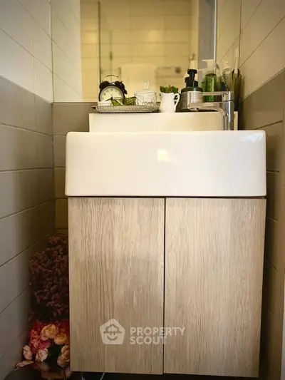 Chic bathroom with modern sink and stylish decor, perfect for urban living.